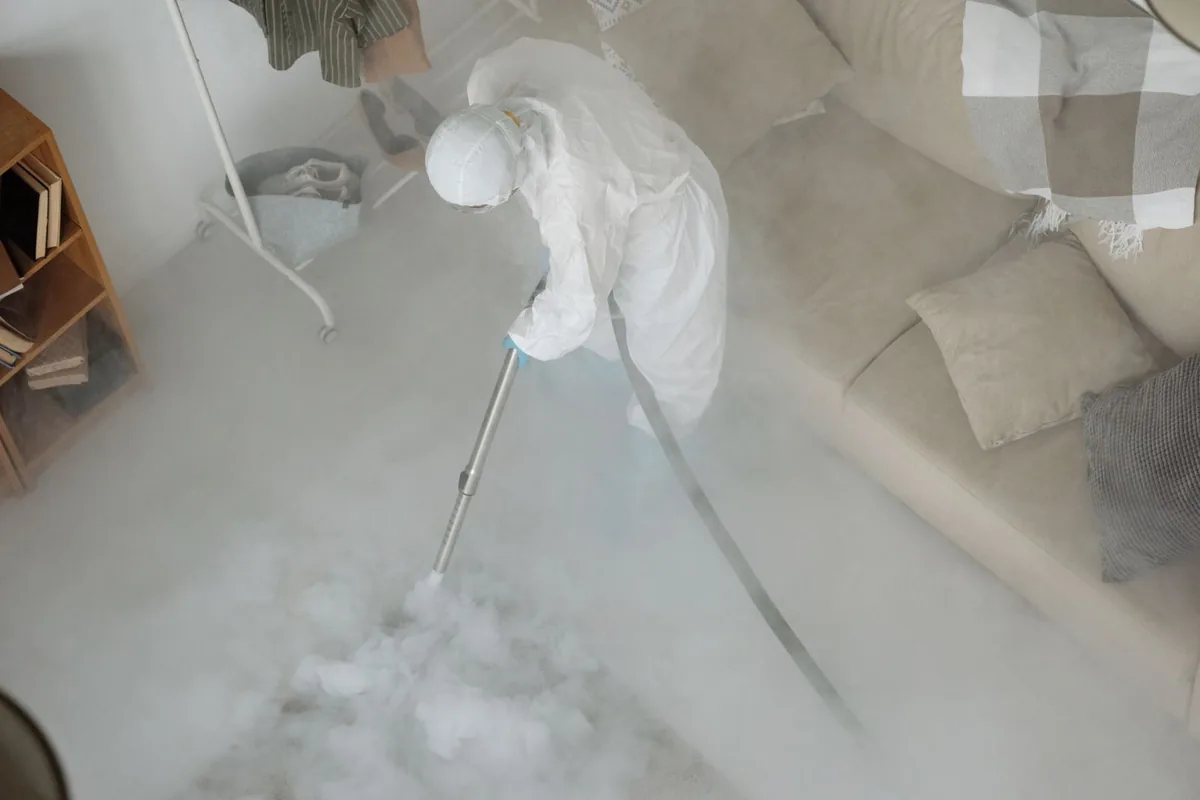 Biohazard cleanup technician in protective equipment, Mazomanie, WI